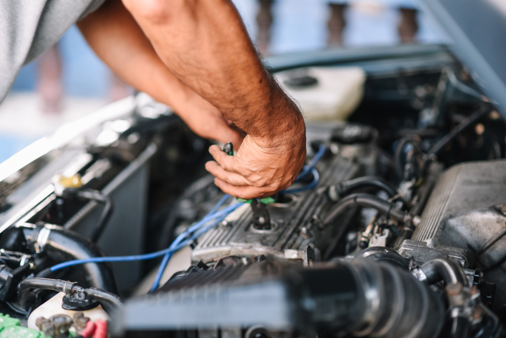 Auto Mechanic Working On A Car